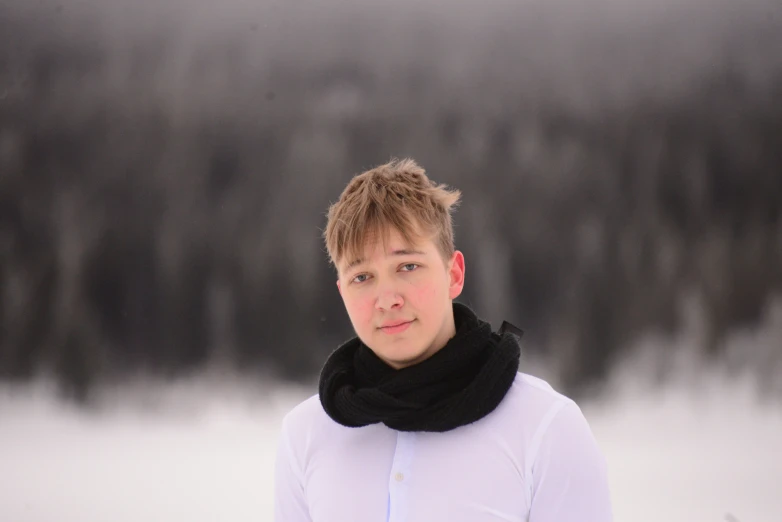 a lady wearing white and a black scarf