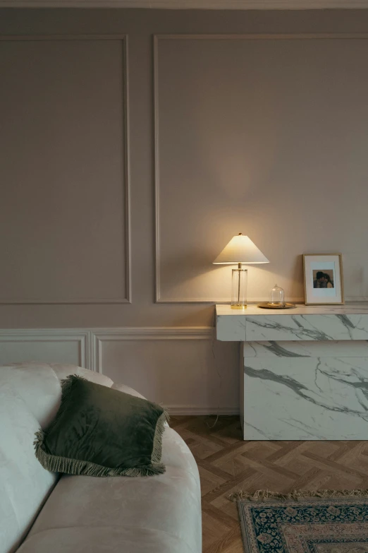 living room with couch, marble counter and lamp