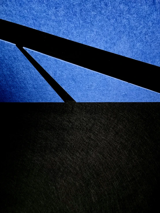 black square structures against a blue sky