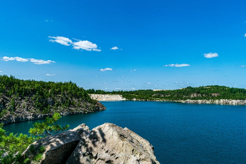 blue water and green vegetation at the edge of an island