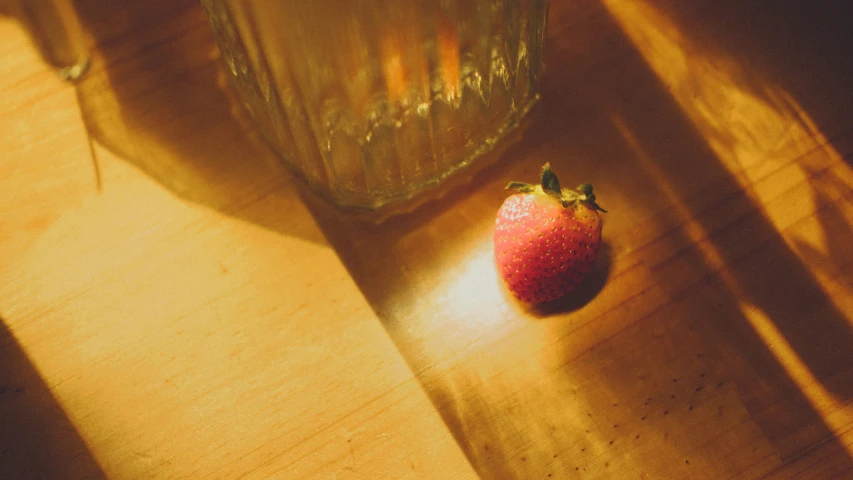 the red strawberry has fallen away in the sunlight