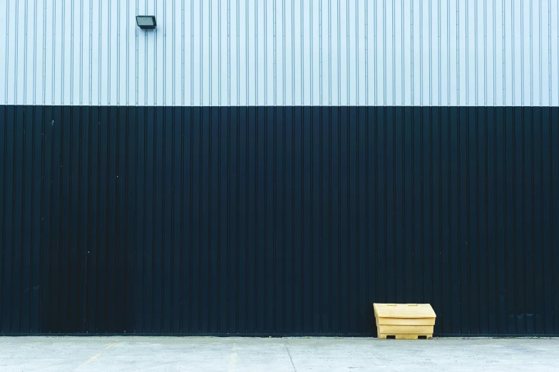 a bench sitting against the side of a building