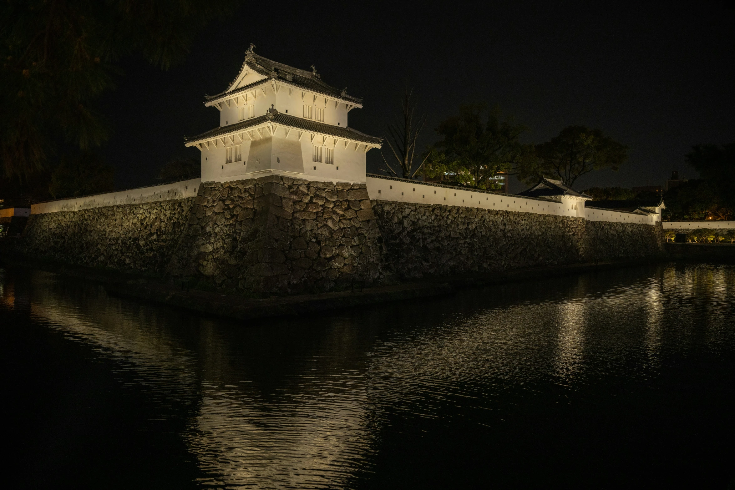 a large clock tower sitting on top of a river