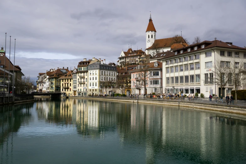 there is a reflection of some buildings in the water