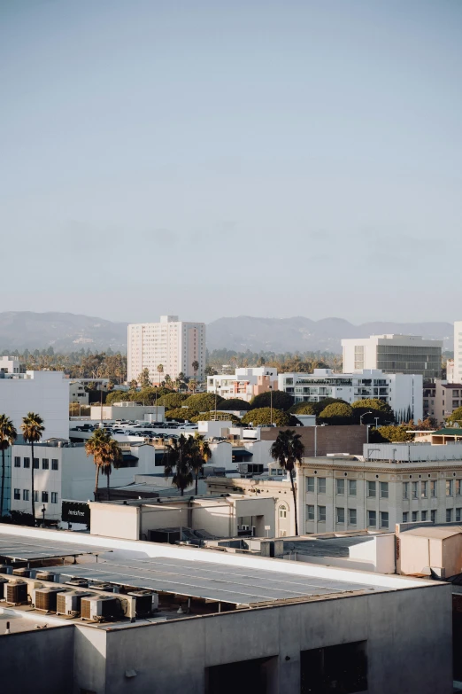 a view of a town across the river from a rooftop top