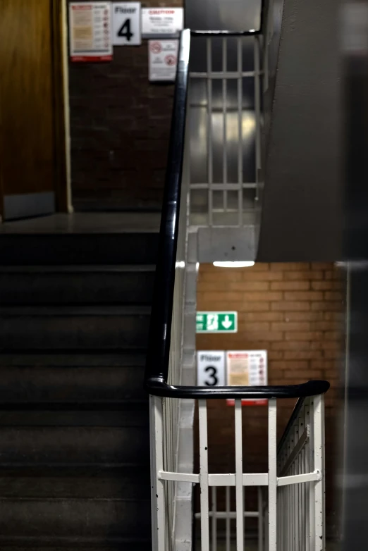 the white railing and steps leading to a building