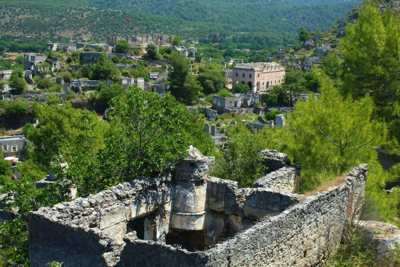 an old town in the middle of a lush green countryside