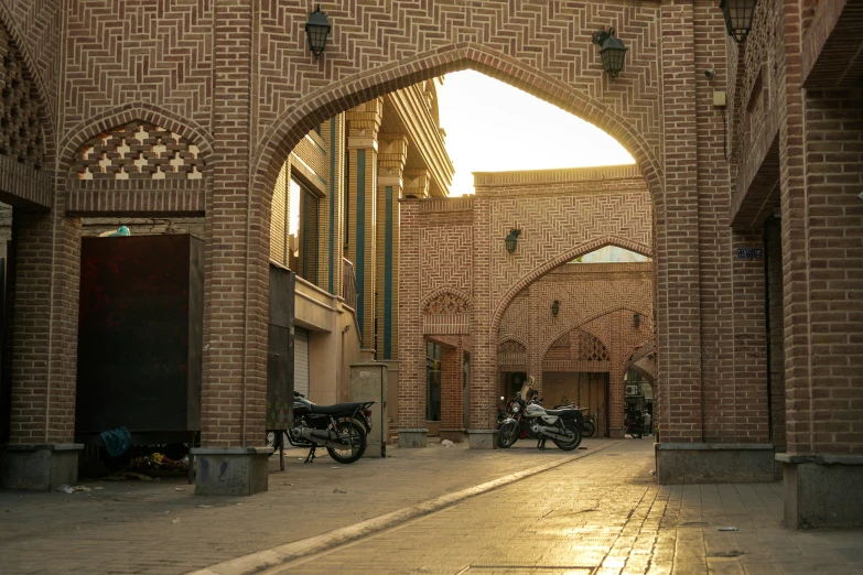 two motorcycles that are parked in a building