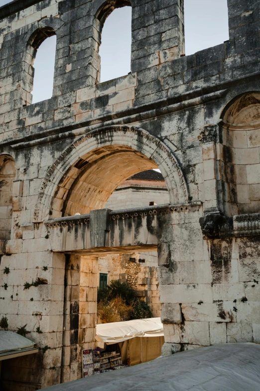 old brick building with arches and a couch