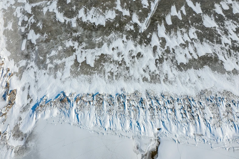 the snowy mountain range covered in snow