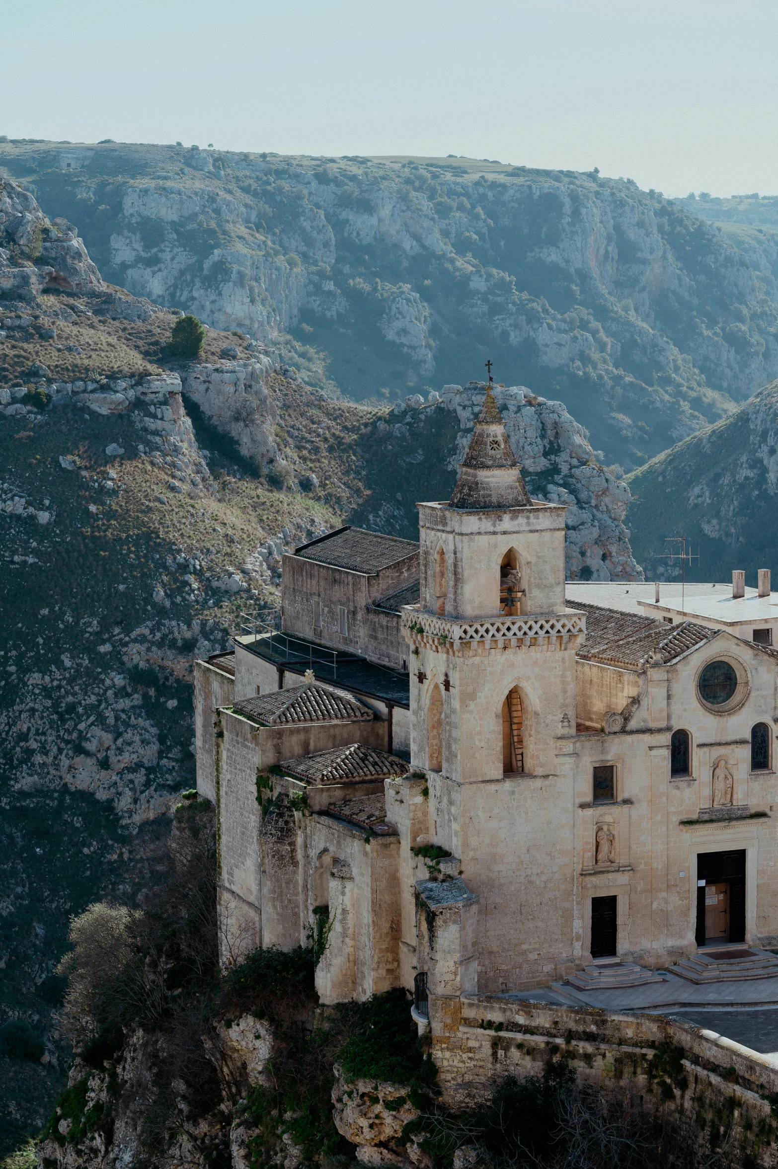 a tall building on the top of a hill