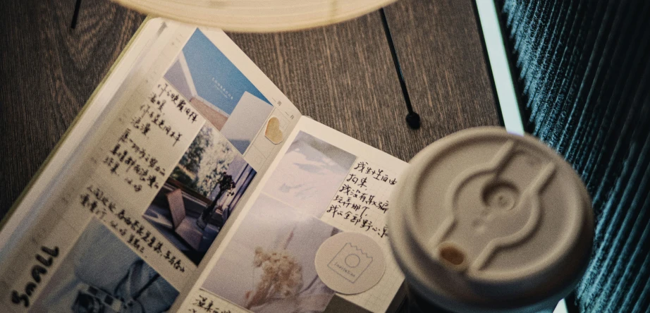 the newspaper is laying on top of the bed