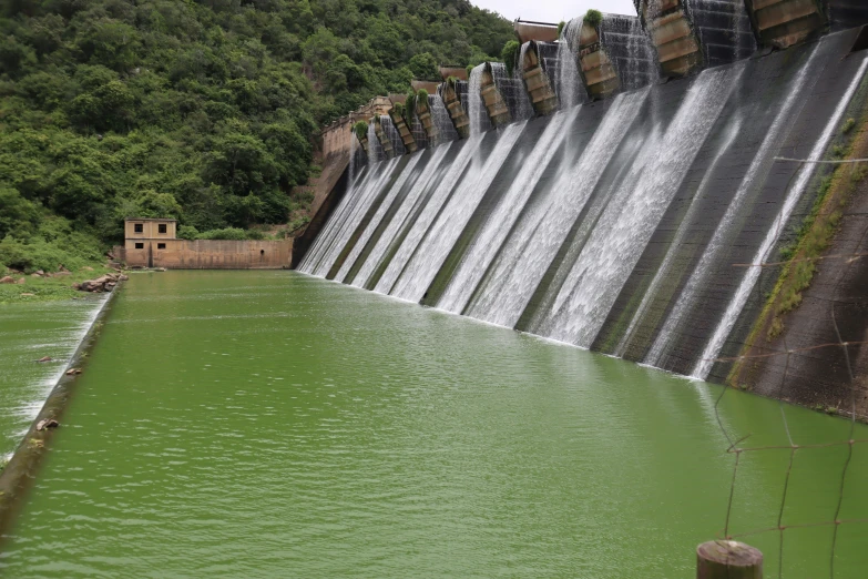 a large river has water casings falling off the side