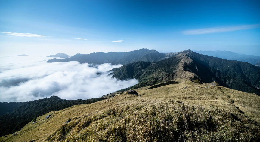 clouds are rolling in as seen from the top of the mountains