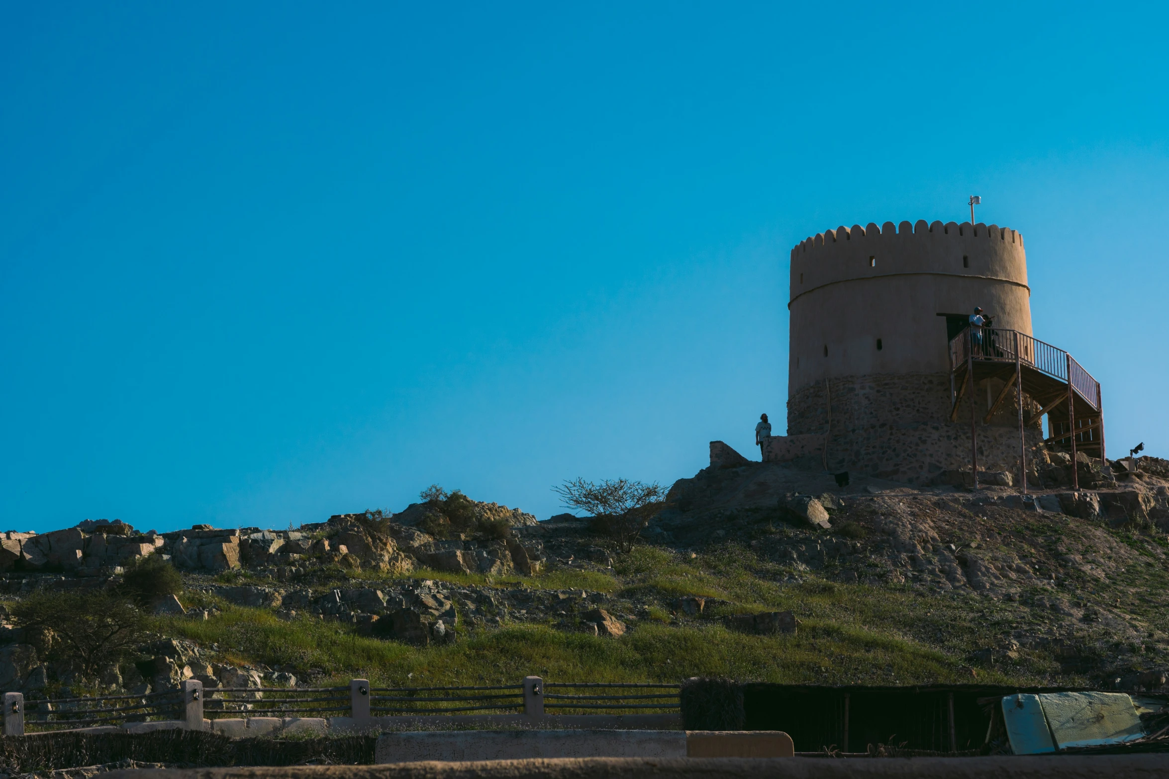 a tower sitting on top of a hill