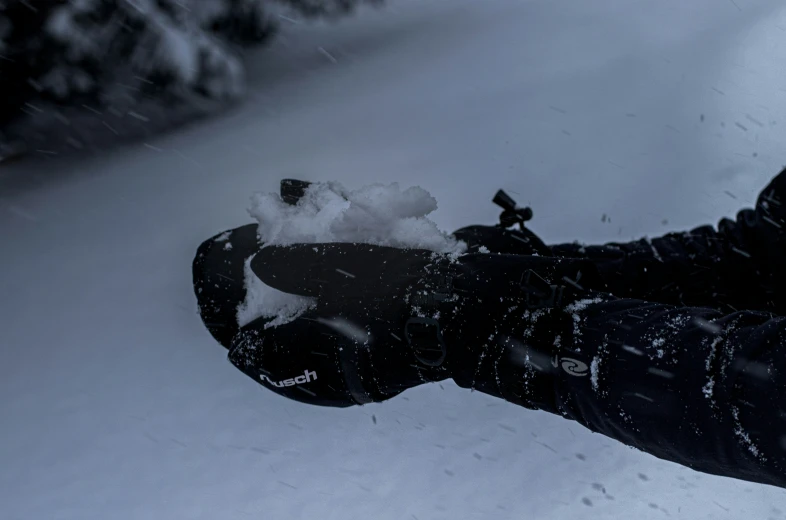 a person riding skis on a snow covered surface