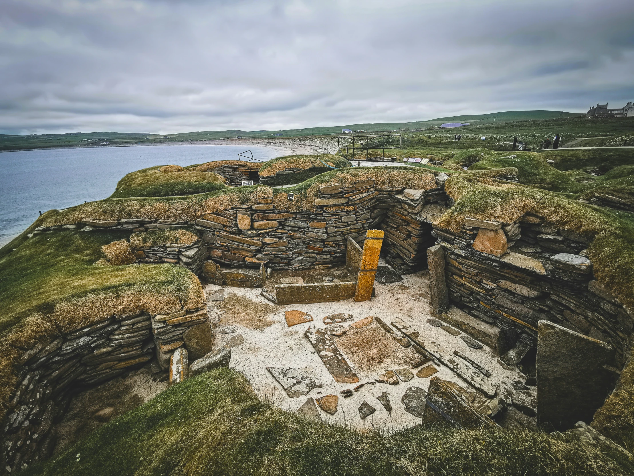 there is an old structure on the hill by the water