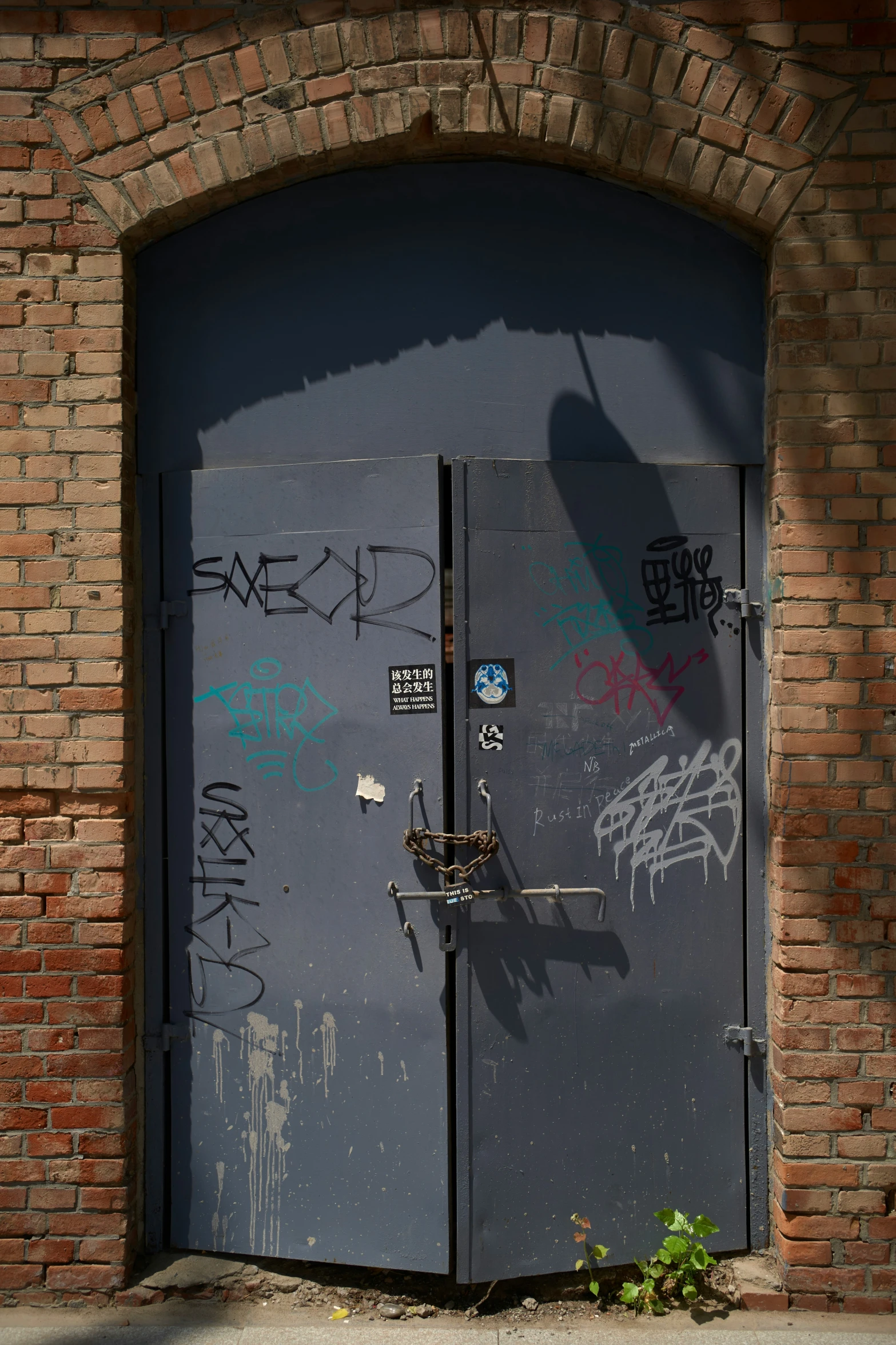 a grey door with some writing on it