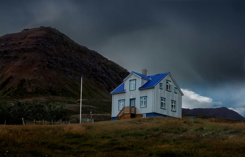 a home nestled on the side of a mountain