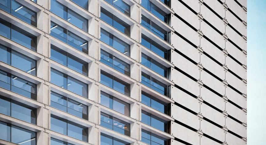 the tall concrete building has many windows on each side