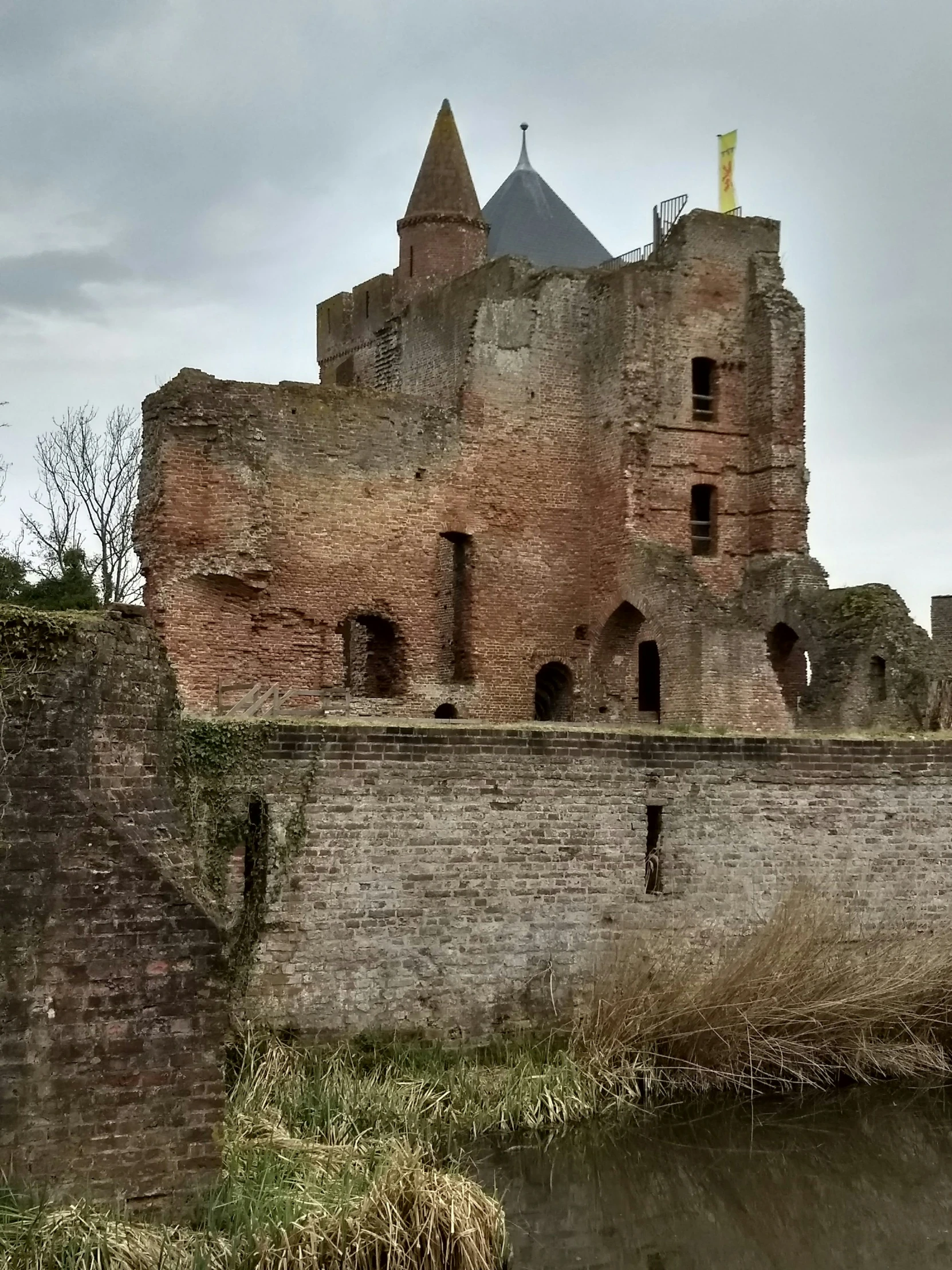 a castle on a wall with water in the foreground