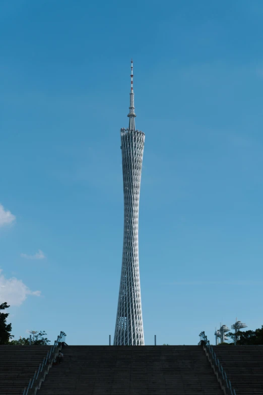 a large spire structure sitting in the middle of a blue sky