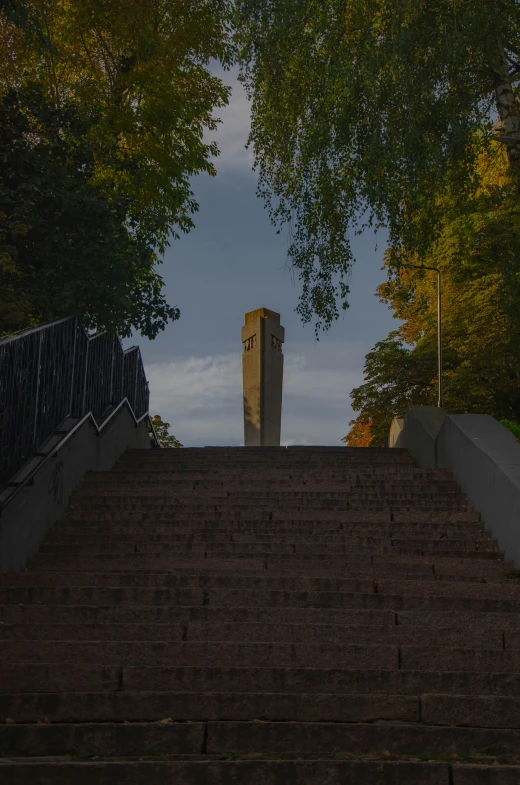 there is a large stair way up to a tall building