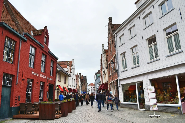 a town center is full of narrow buildings