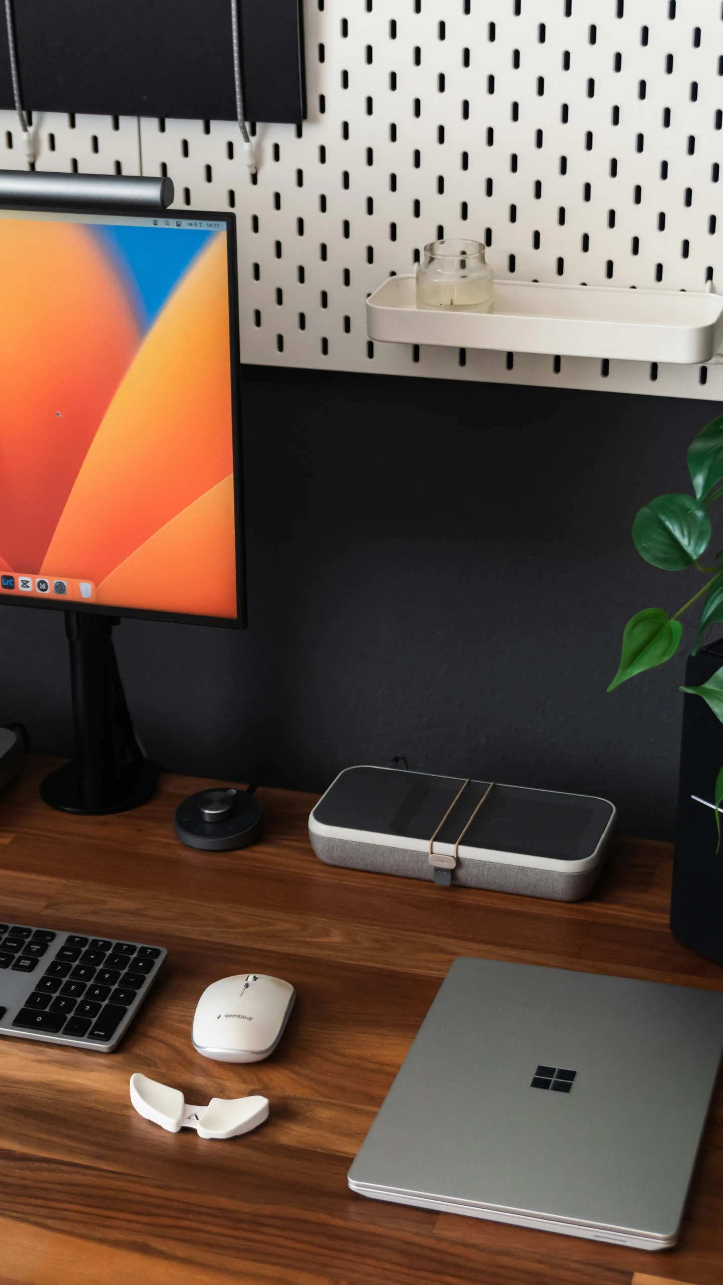 a computer on a wooden desk in a room