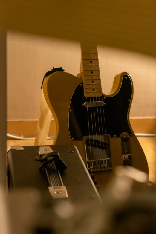 an old guitar that has been placed in its stand