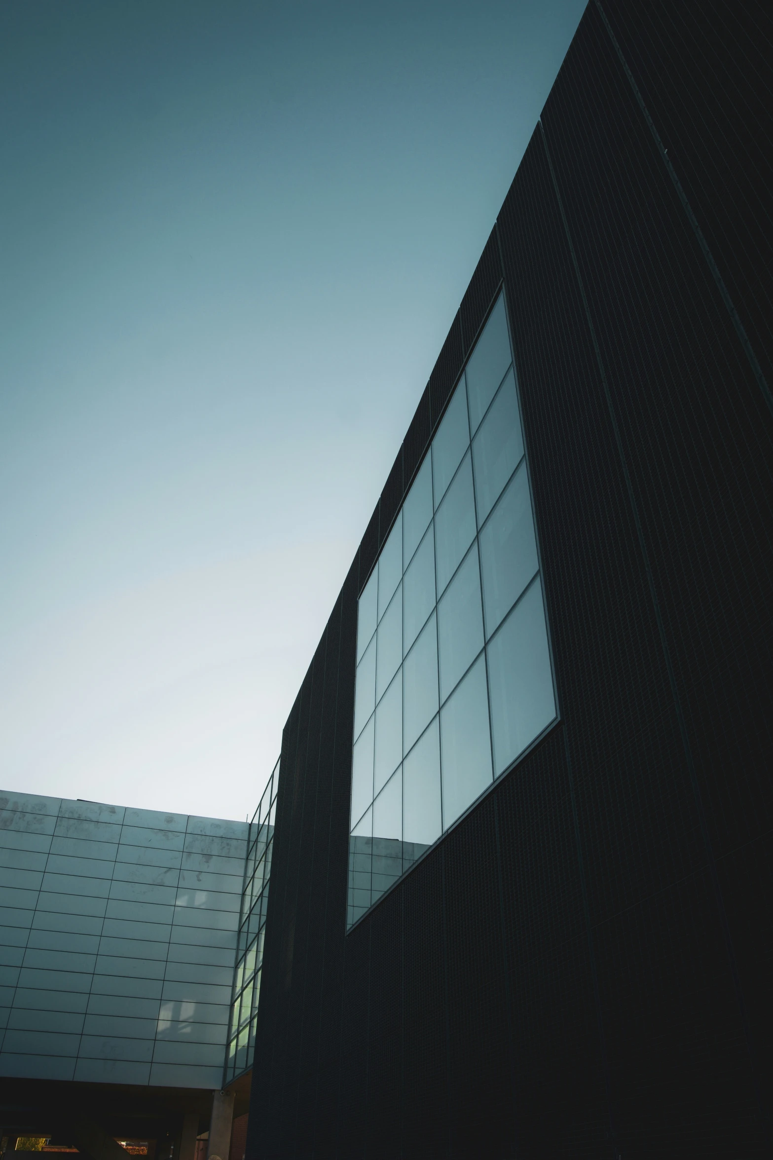 a building with multiple windows against the sky