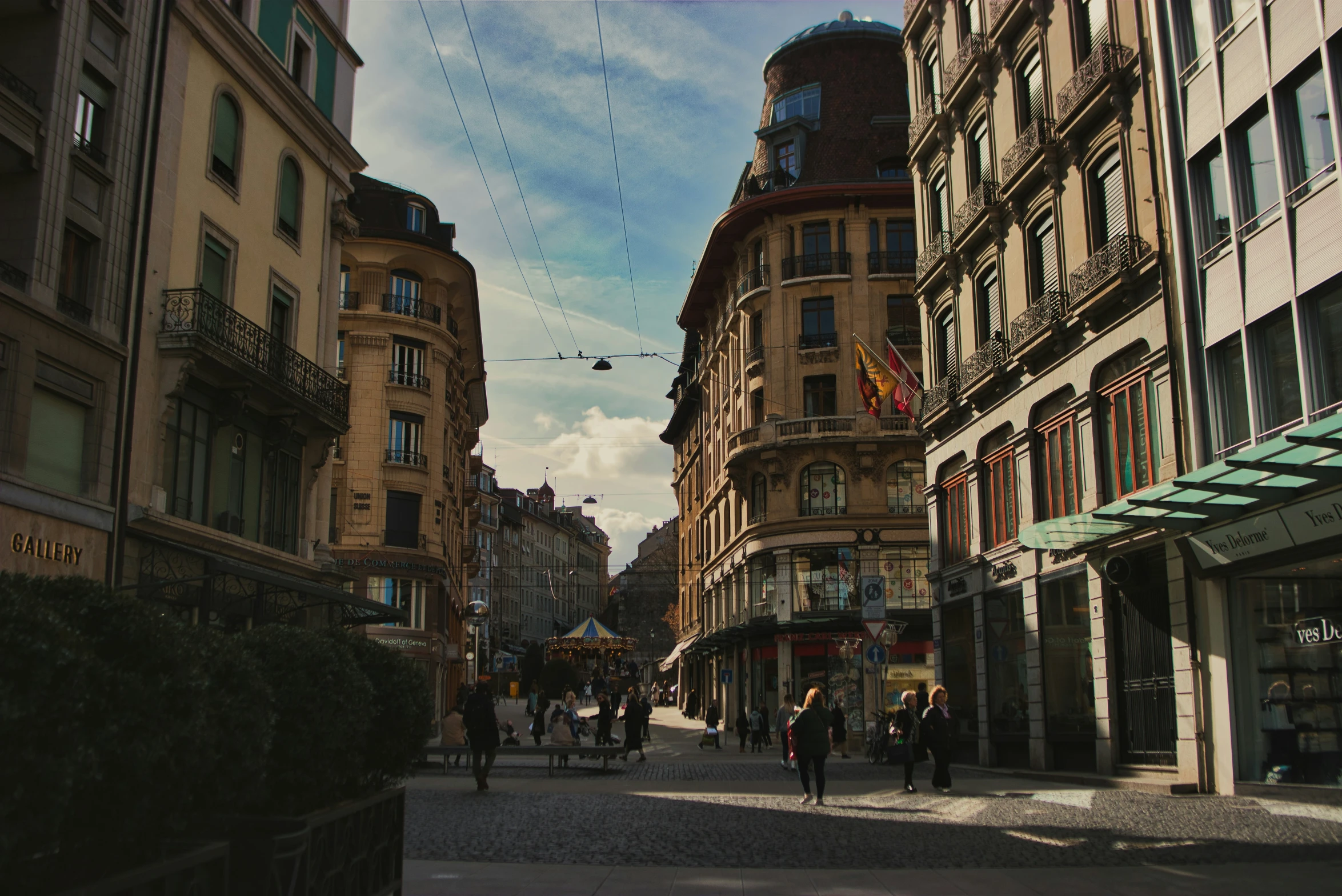 people walk on a street in an alley