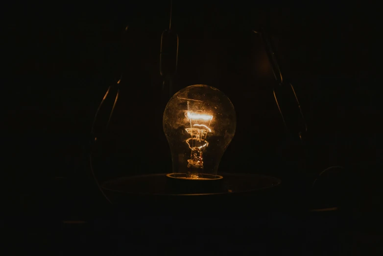 a dark room with an light bulb glowing in it