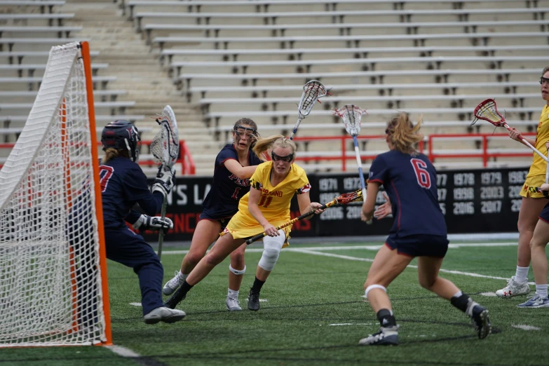 a group of young people playing a game of lacrosse