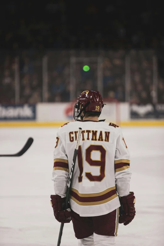 hockey player in uniform on the ice during a game