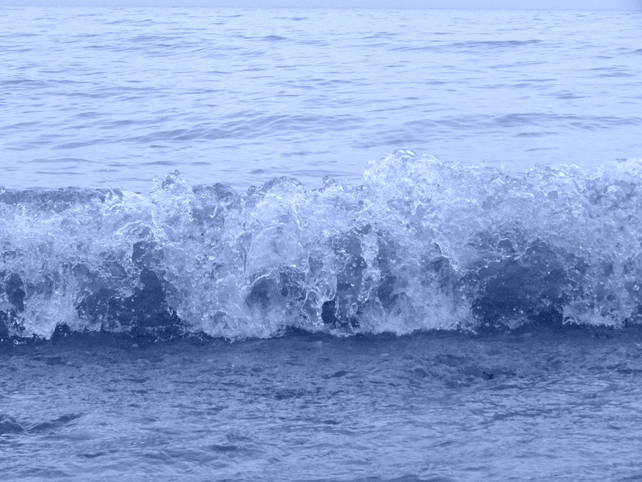 a person is riding a surf board in the ocean