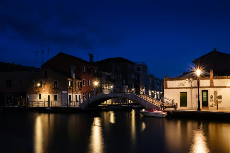 there is a building with a bridge on the water