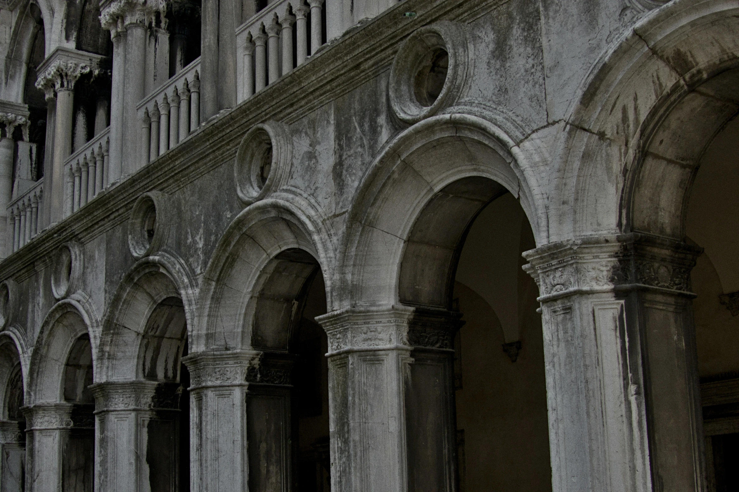 an image of an old building with arches