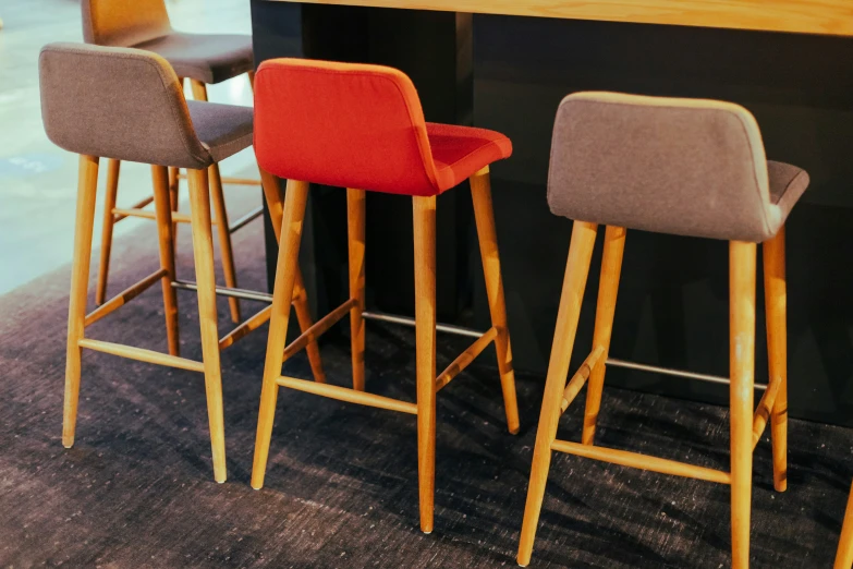 the bar stools and chairs are made of wood