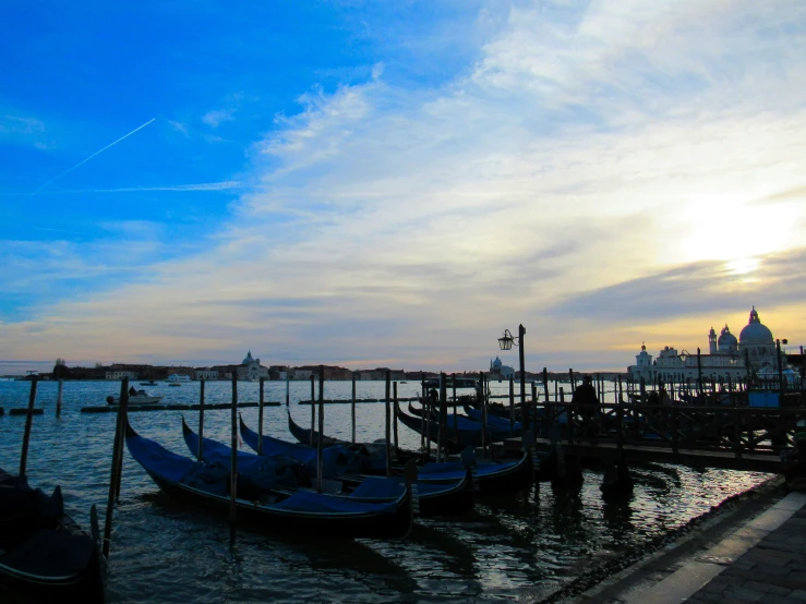 a group of boats floating on top of a river