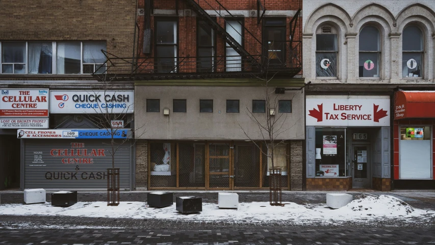 a bunch of street signs on the corner of a building