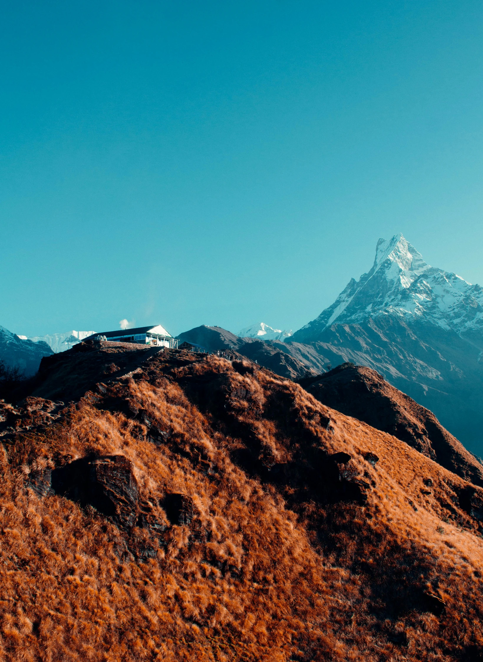 a mountain with a very high steep peak