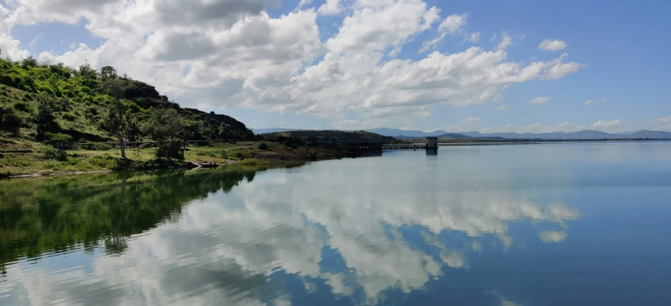 a lake with some water and clouds in it