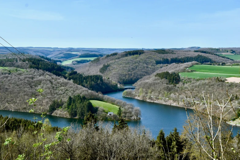 a view over a river with mountains in the background