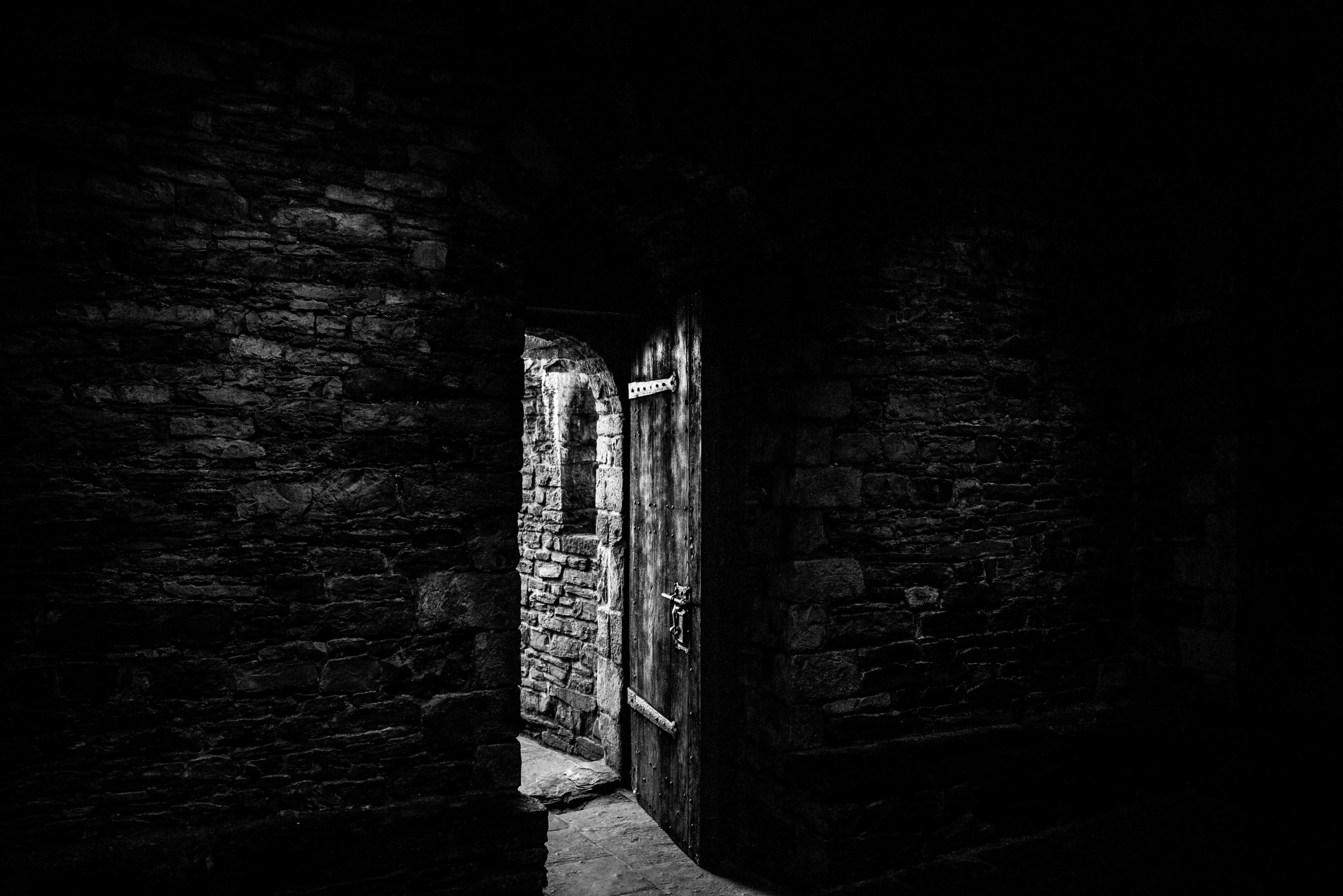 a door with the light on, in black and white