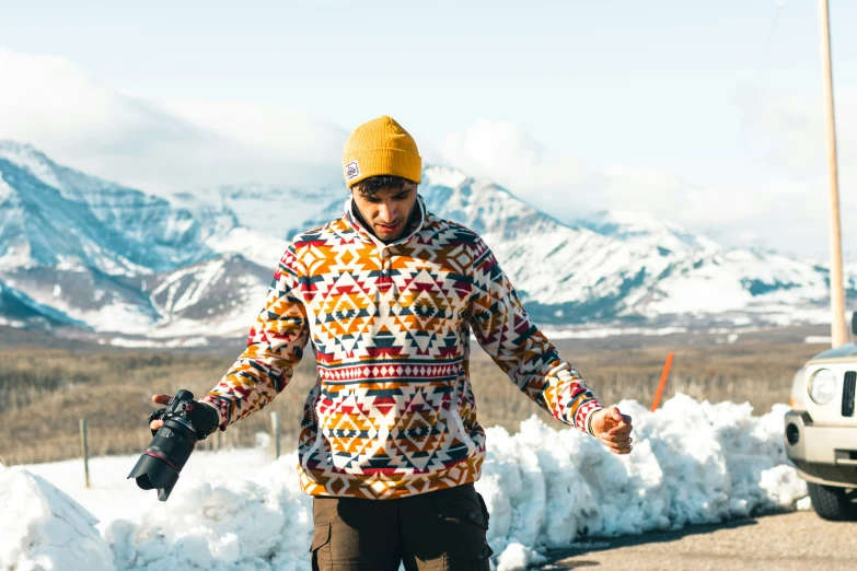 a man riding a snowboard down a street