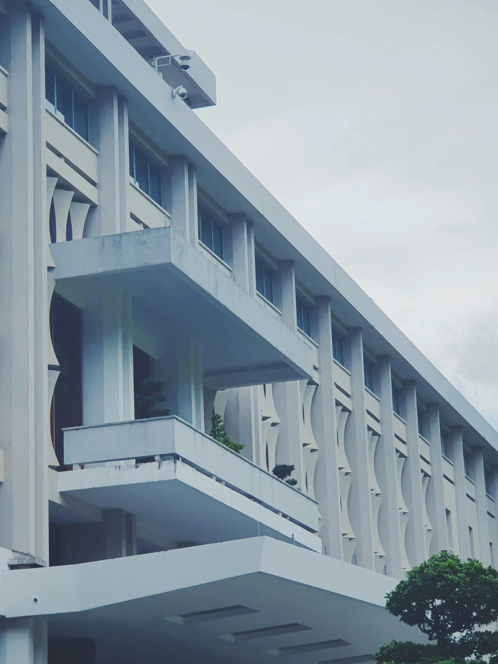 an artistic pograph shows a building with several balconies