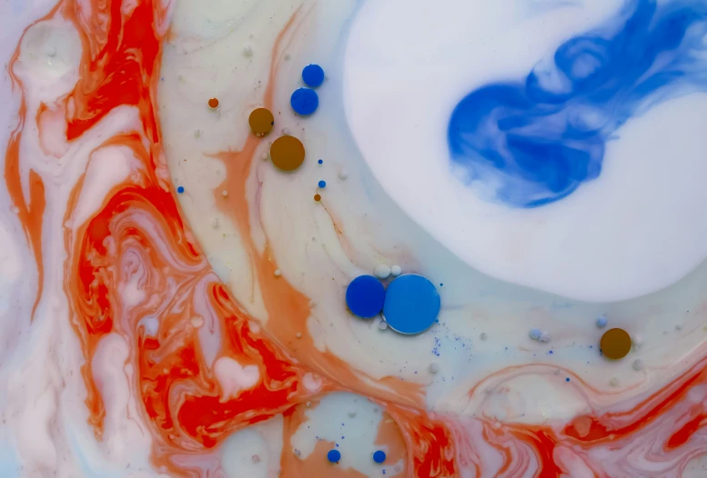 the bottom of a glass dish with red, white, and blue swirls