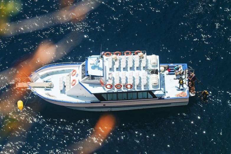 a boat floating through water on a sunny day