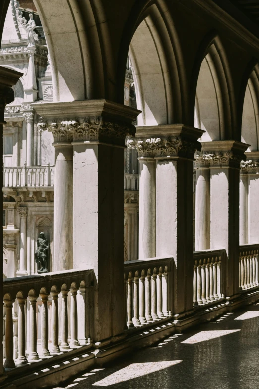 the stone columns and arches are in the sun